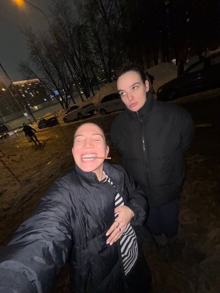 Nighttime street photos capture playful moments in snowy Moscow