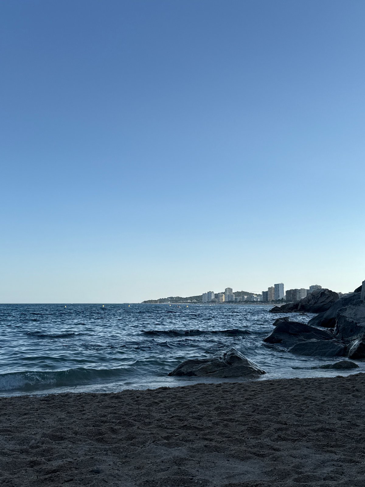 Afternoon on the Costa Brava: coastline, tattoos, and beach textures