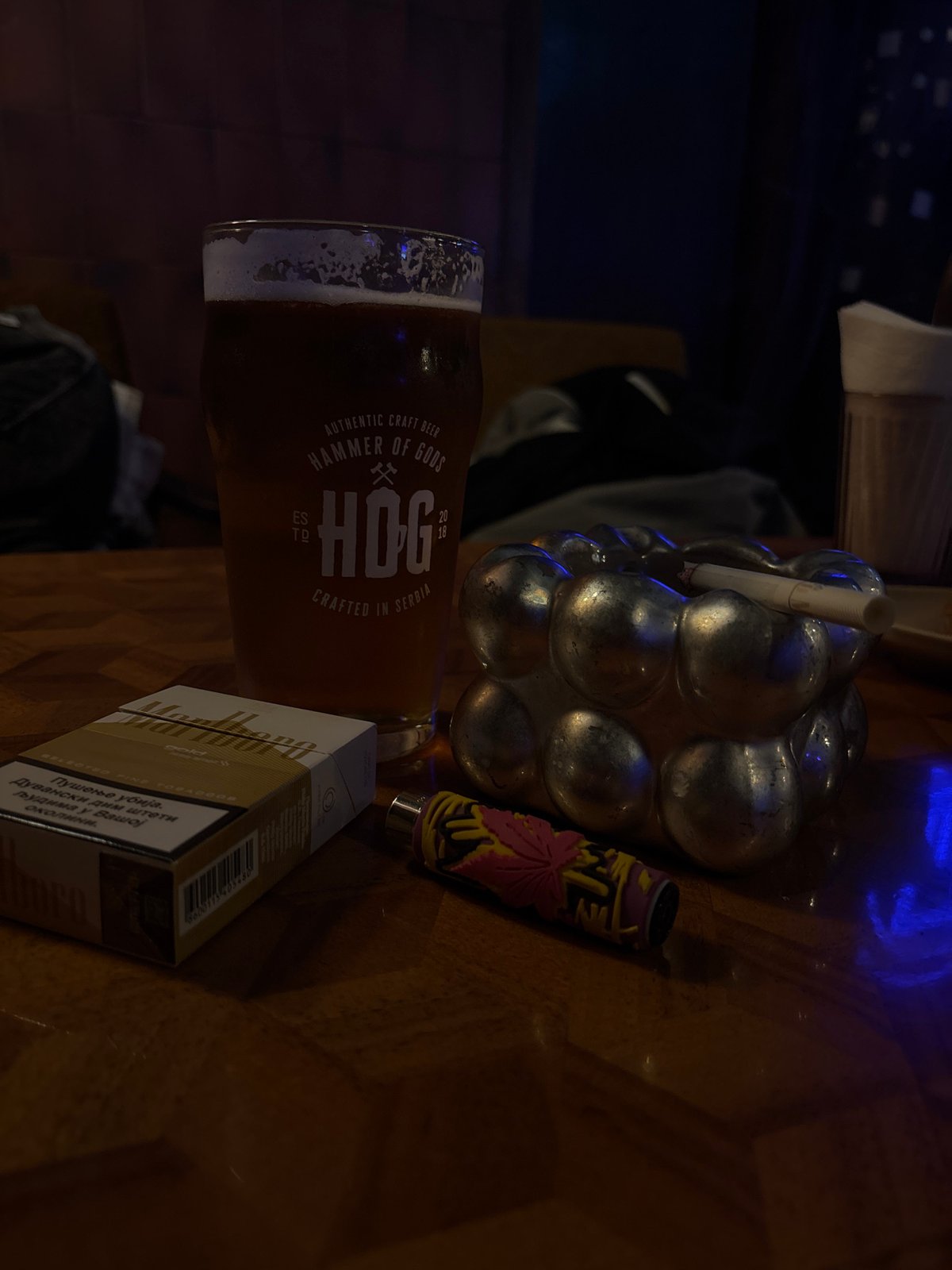 Bar patron drinks craft beer, smokes in Belgrade establishment