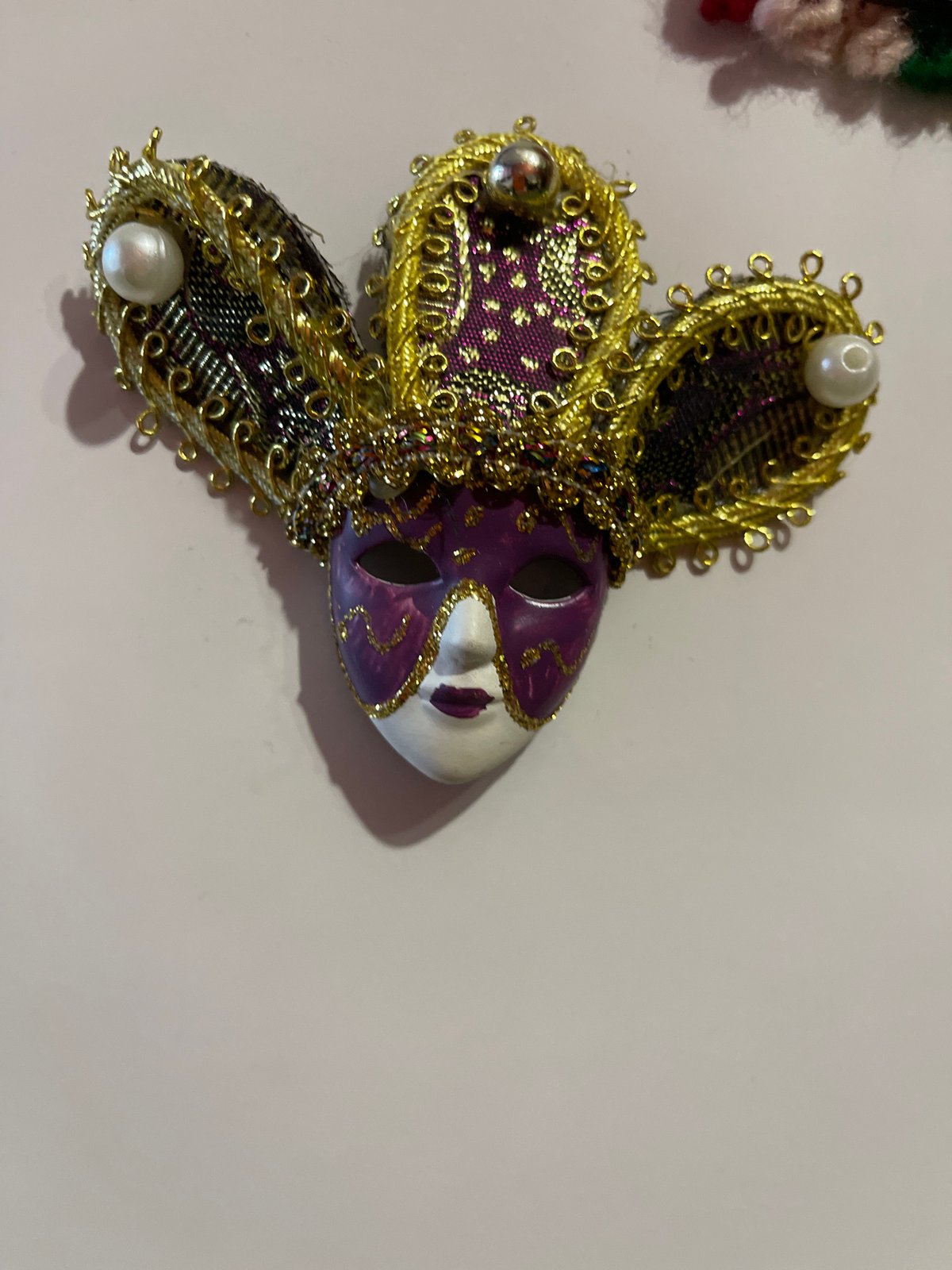 Decorative mask and figurine photographed in Elhovo, Bulgaria