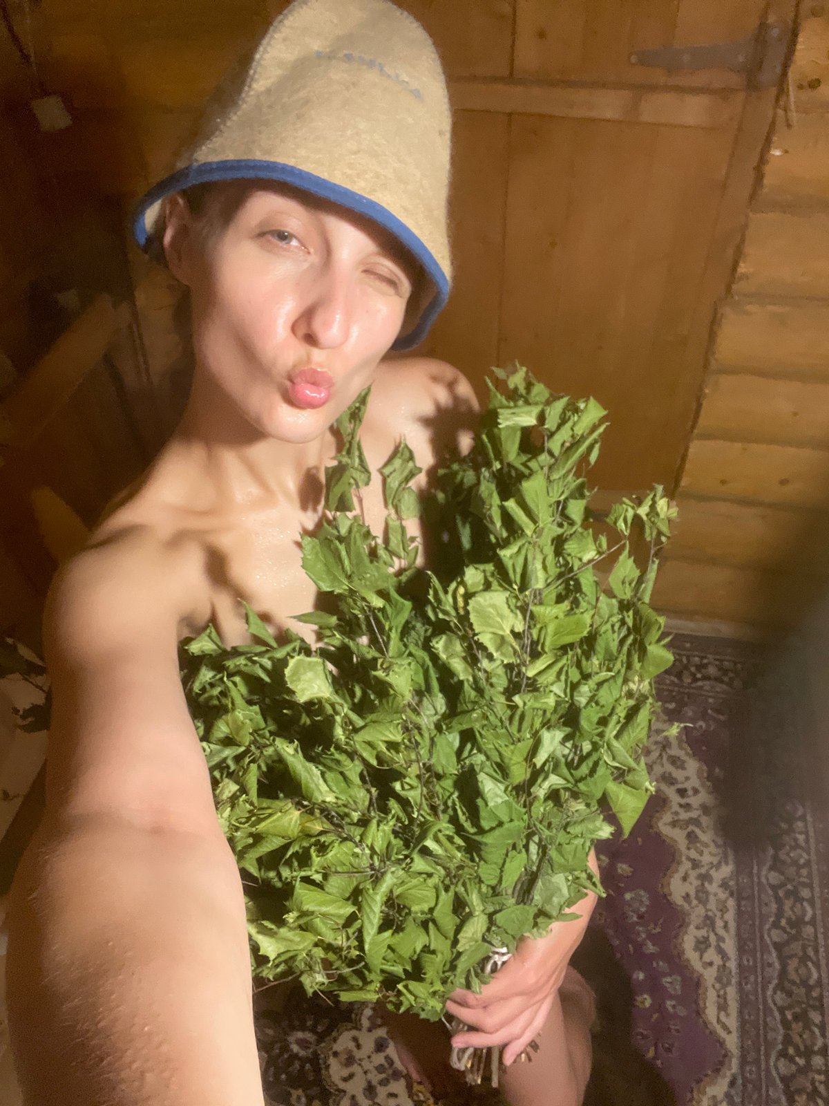 Banya day in Sharkan, complete with sauna hats and birch branches