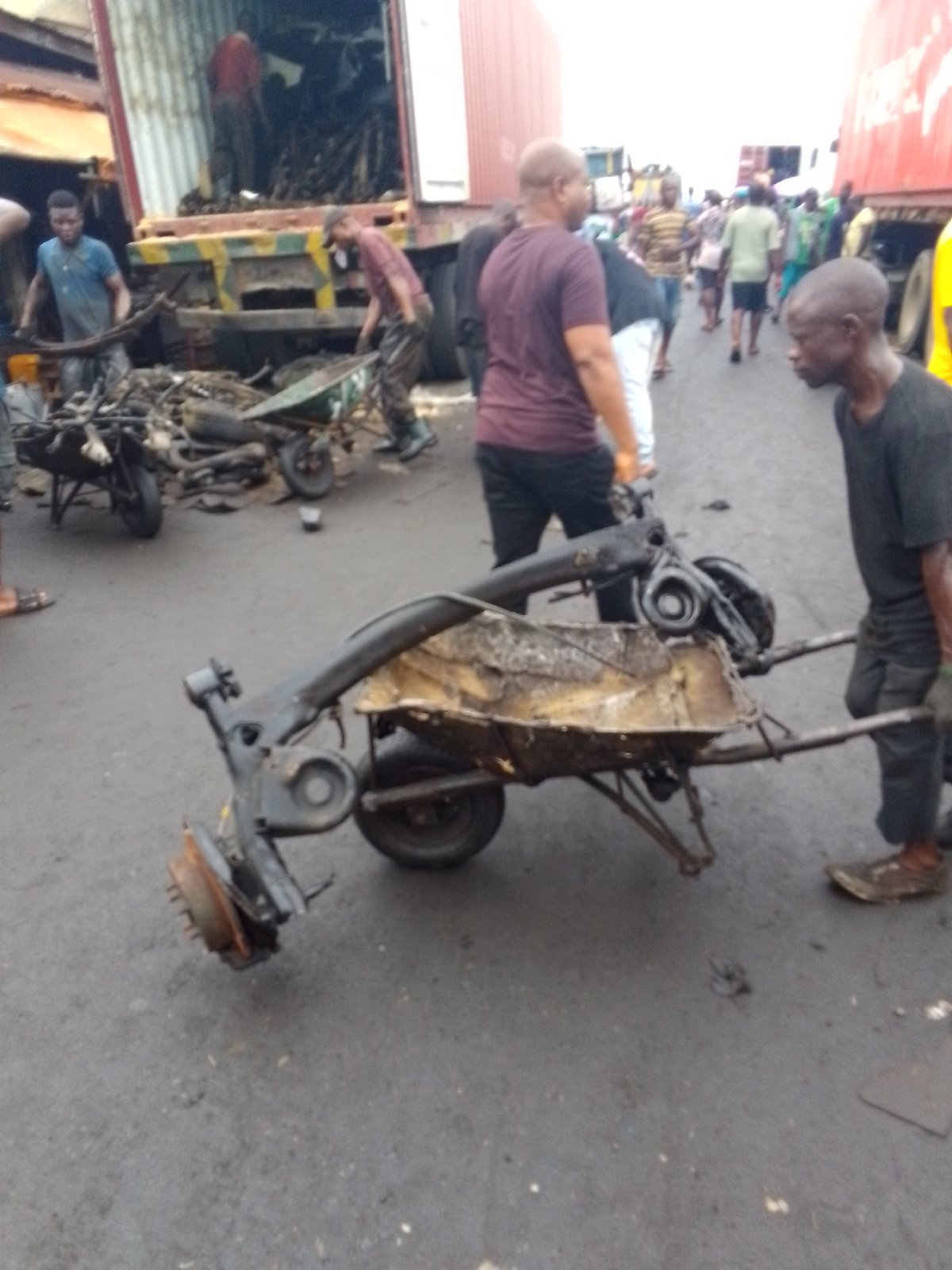 Daily street life and mechanics work documented in Onitsha