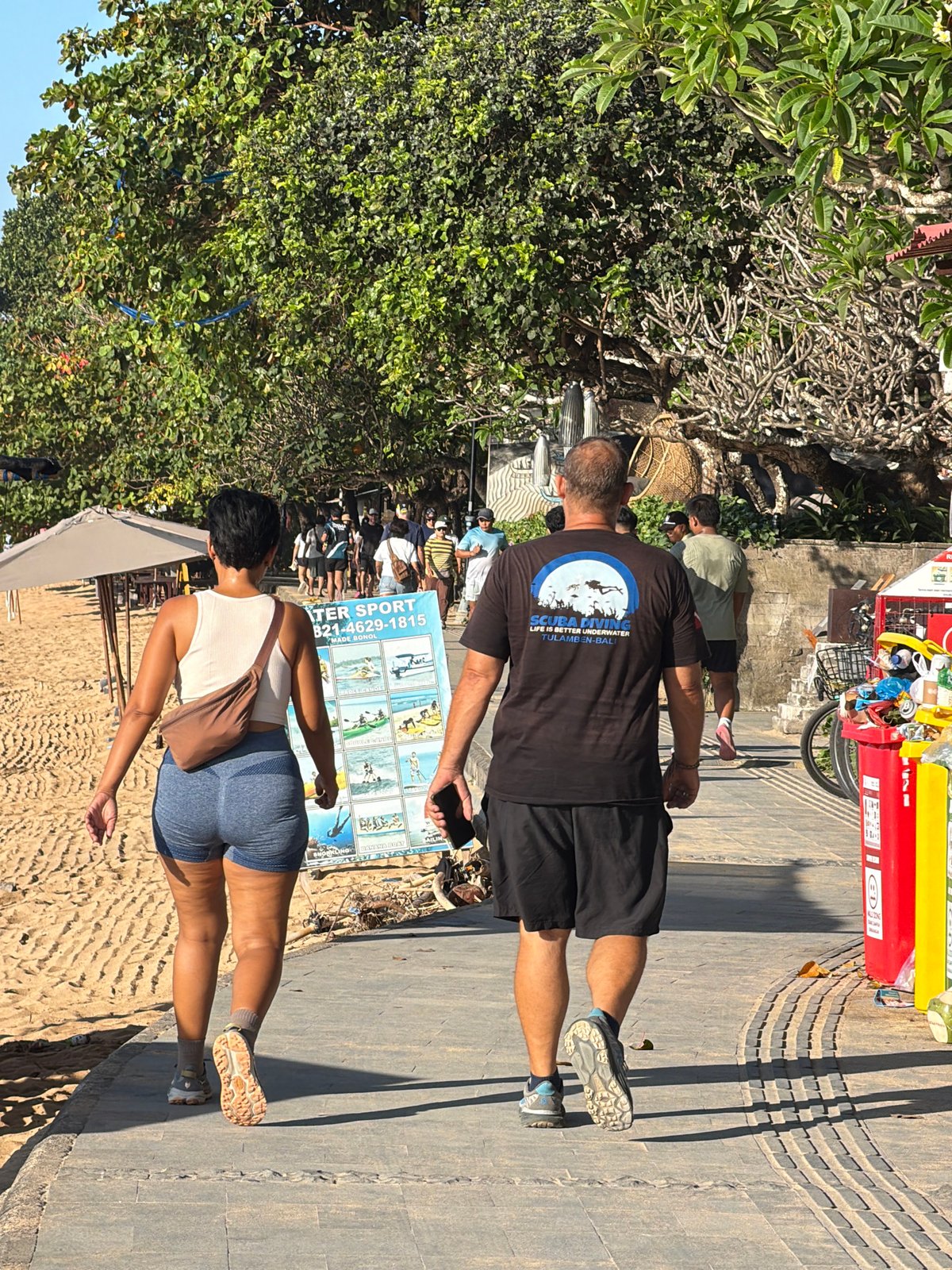 Relaxed afternoon along Sanur Beach's waterfront path