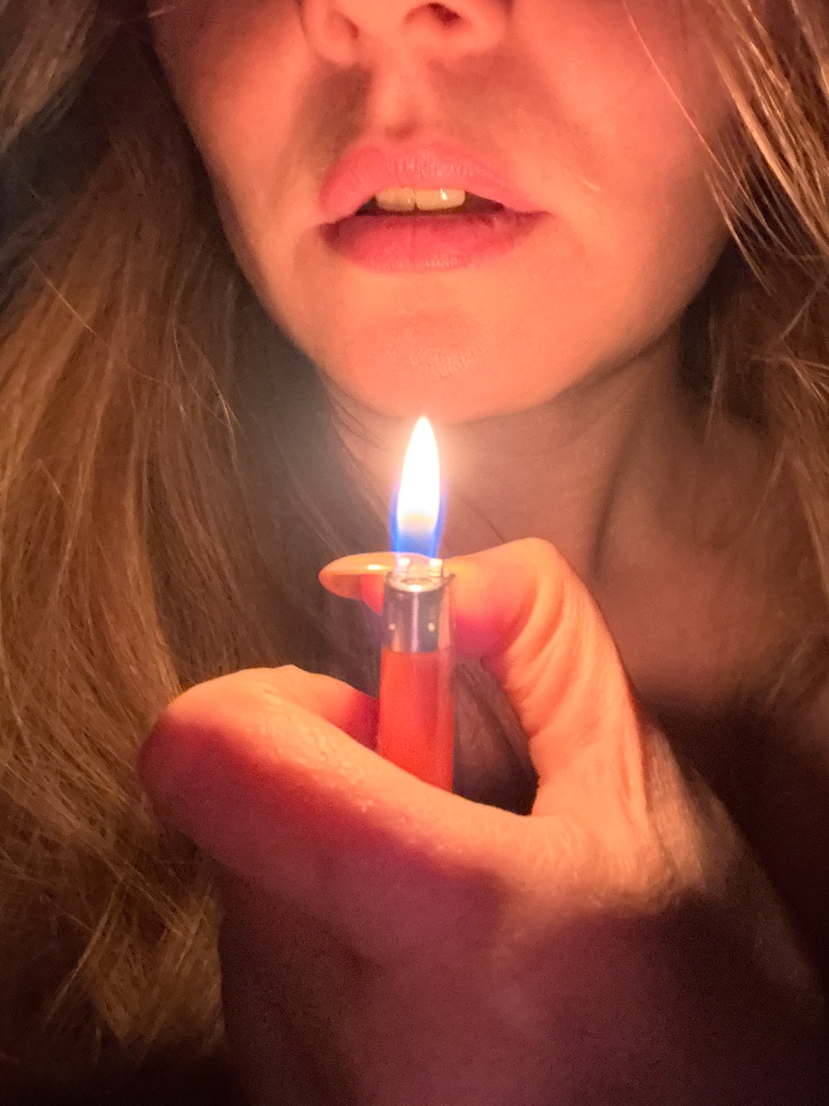 Woman photographs herself with lighter in Chaikovsky, Russia