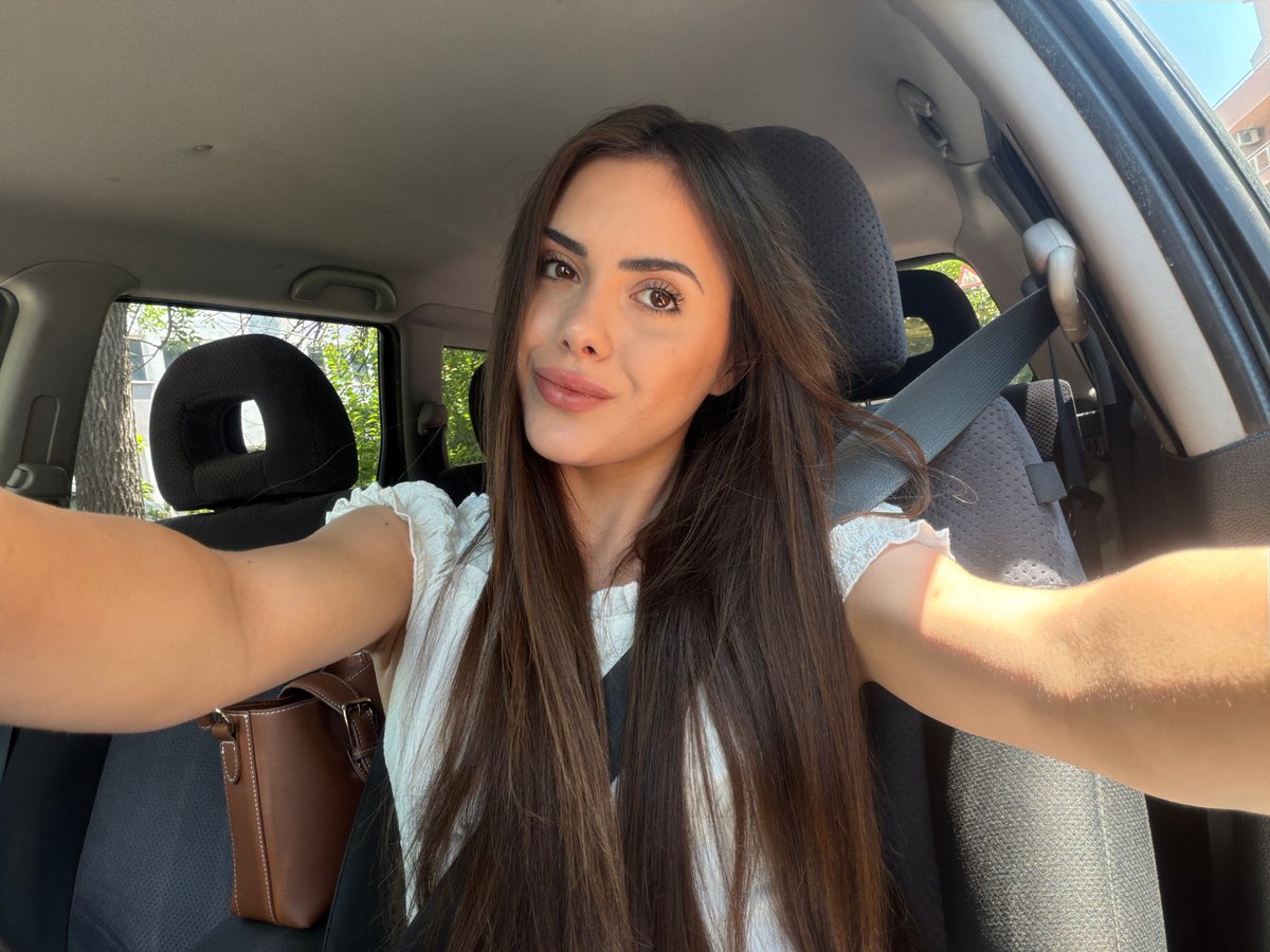 Woman takes selfies in car during morning in Burgas