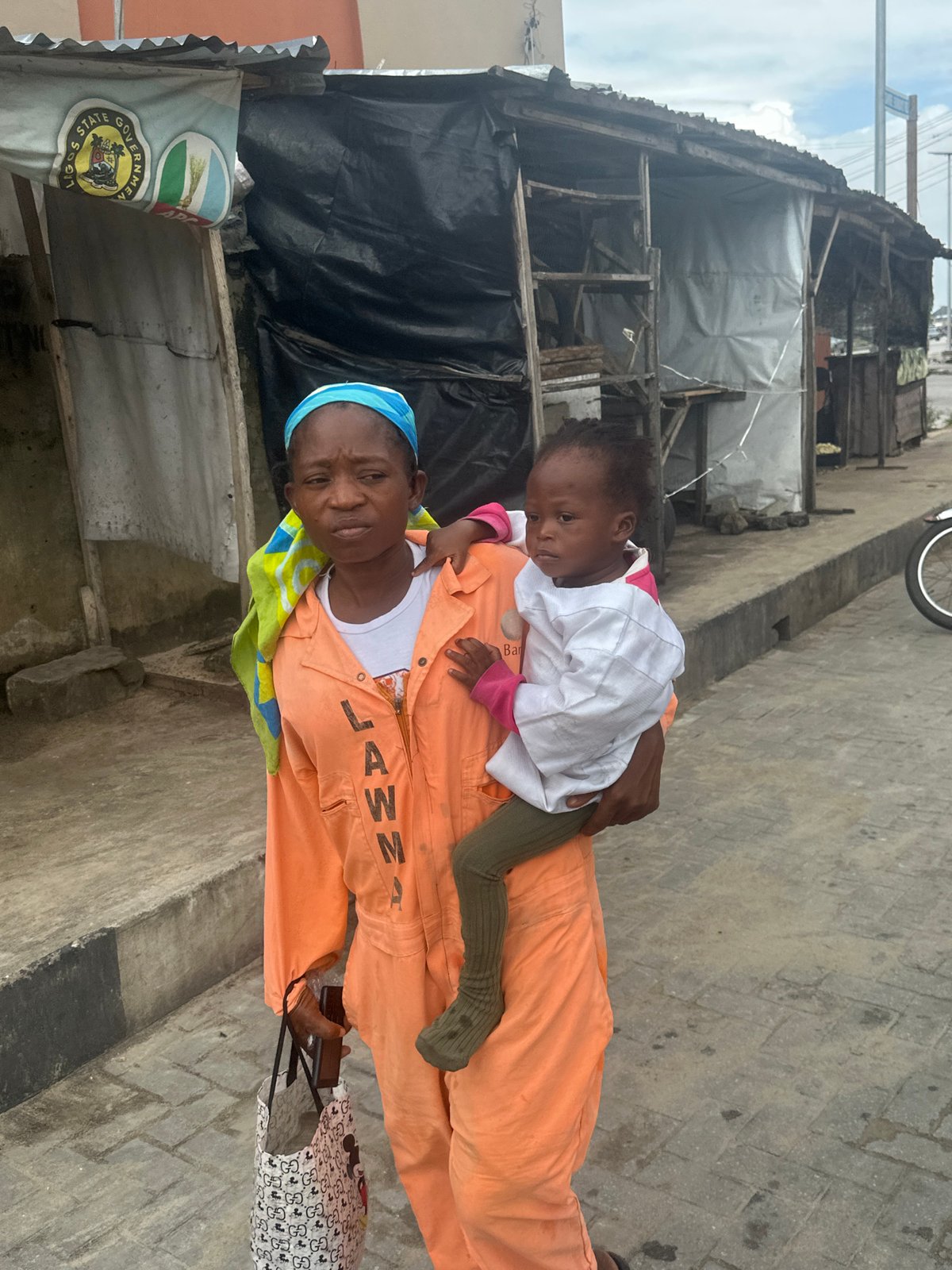 Everyday street life moving through Badagry on a July morning