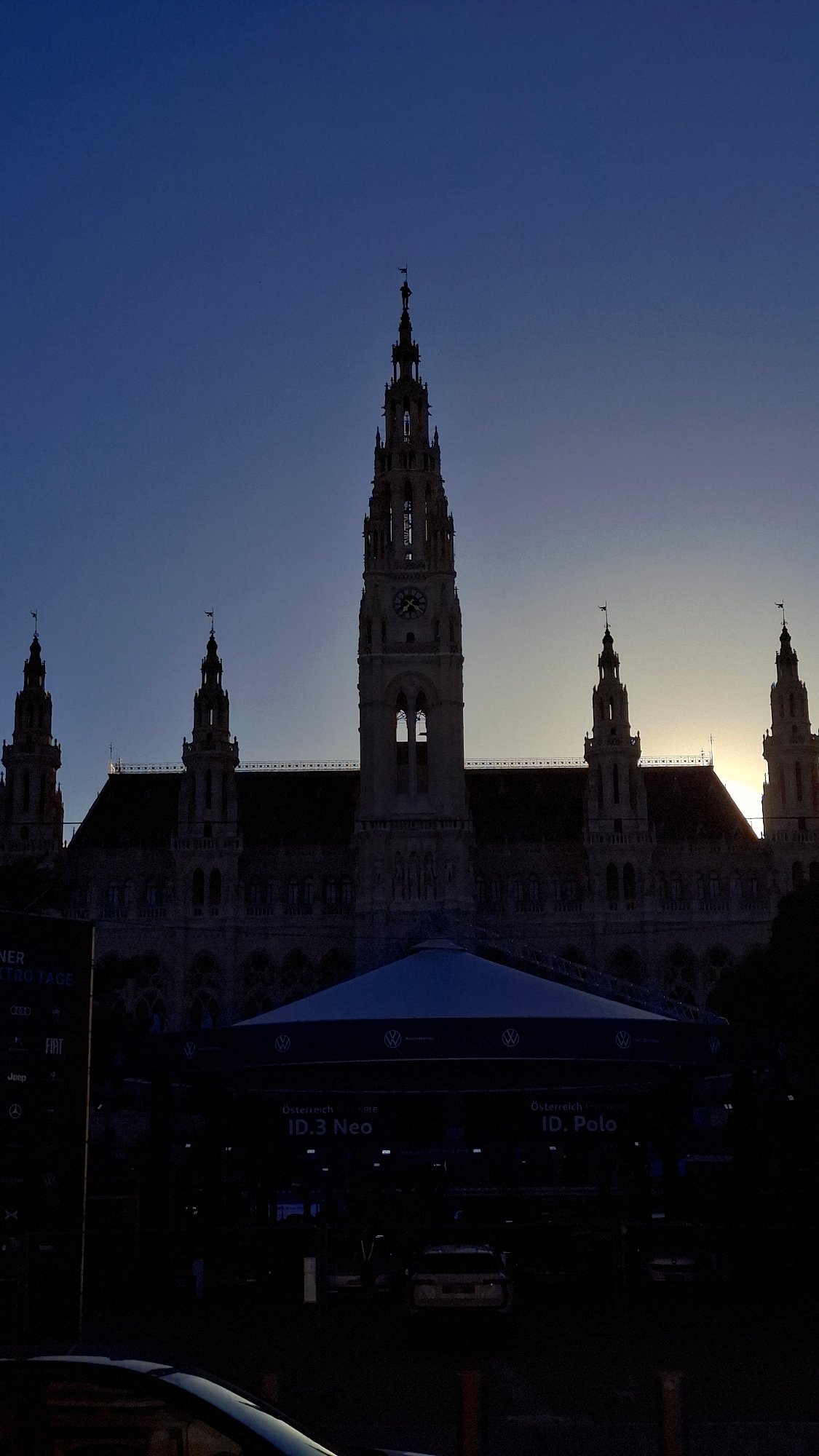 Evening scenes captured around Vienna City Hall, horse carriage spotted