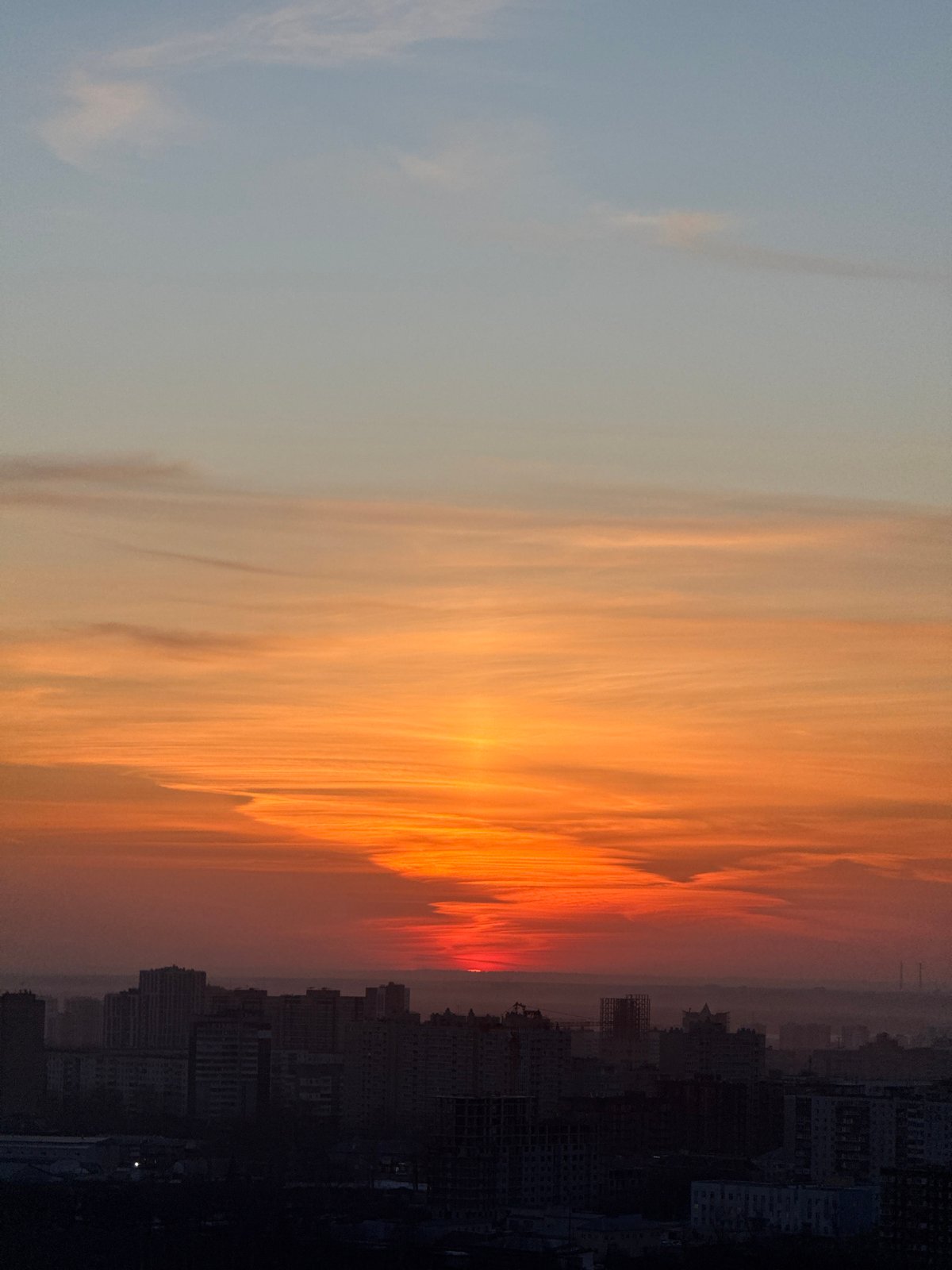 Vibrant sunset illuminates Perm skyline in Russia