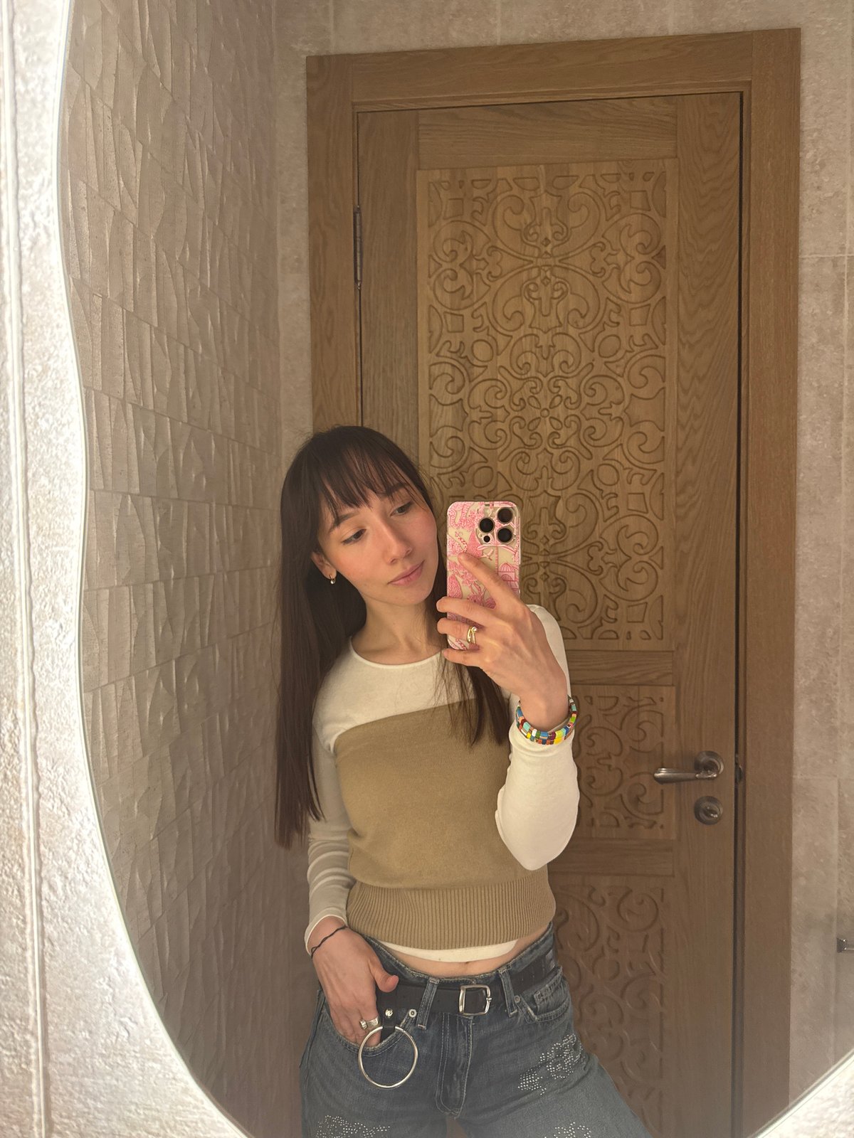 Woman takes bathroom mirror selfie in Kazan