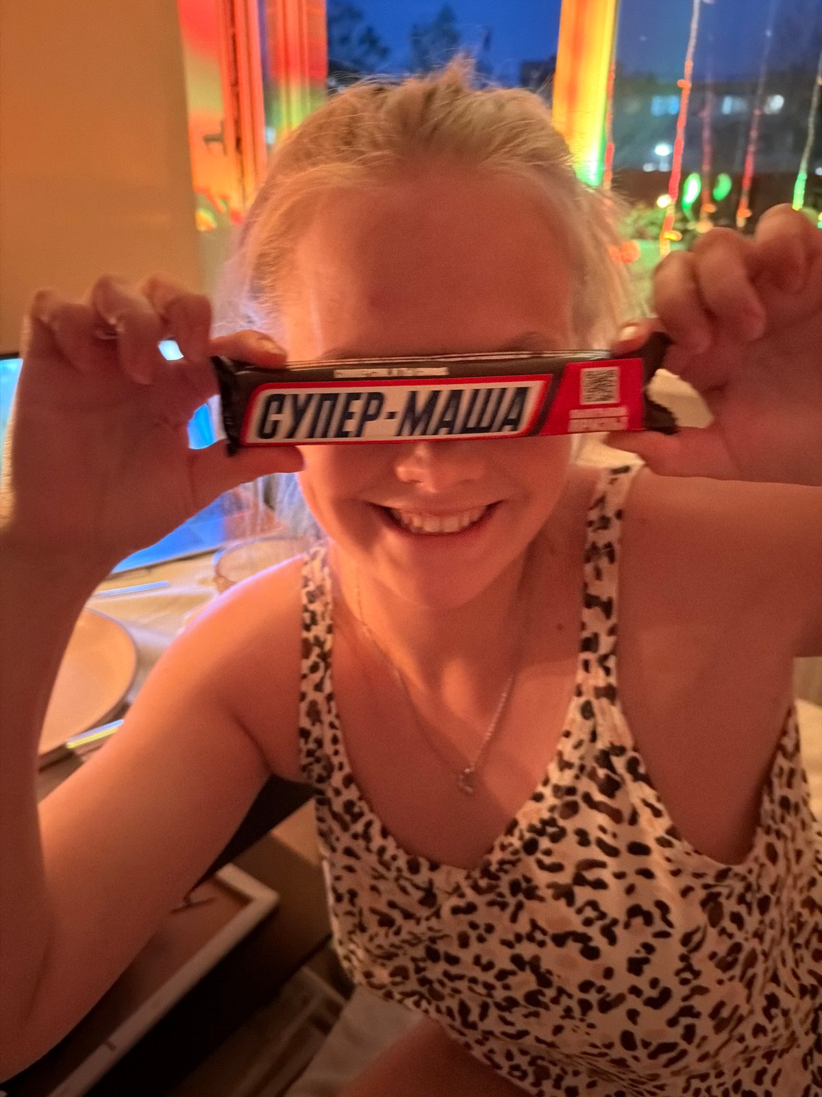 Woman enjoys candlelit dinner in Izhevsk apartment