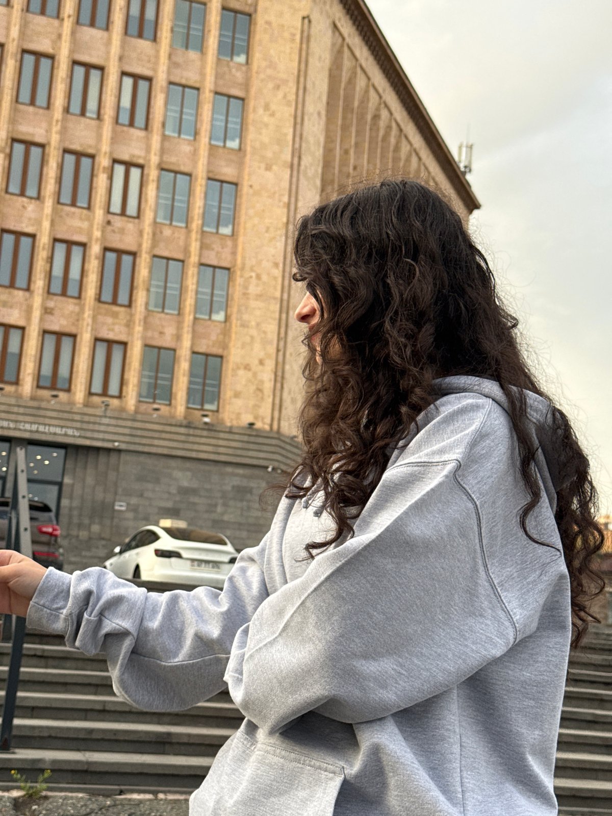 Person in gray hoodie captured in downtown Yerevan