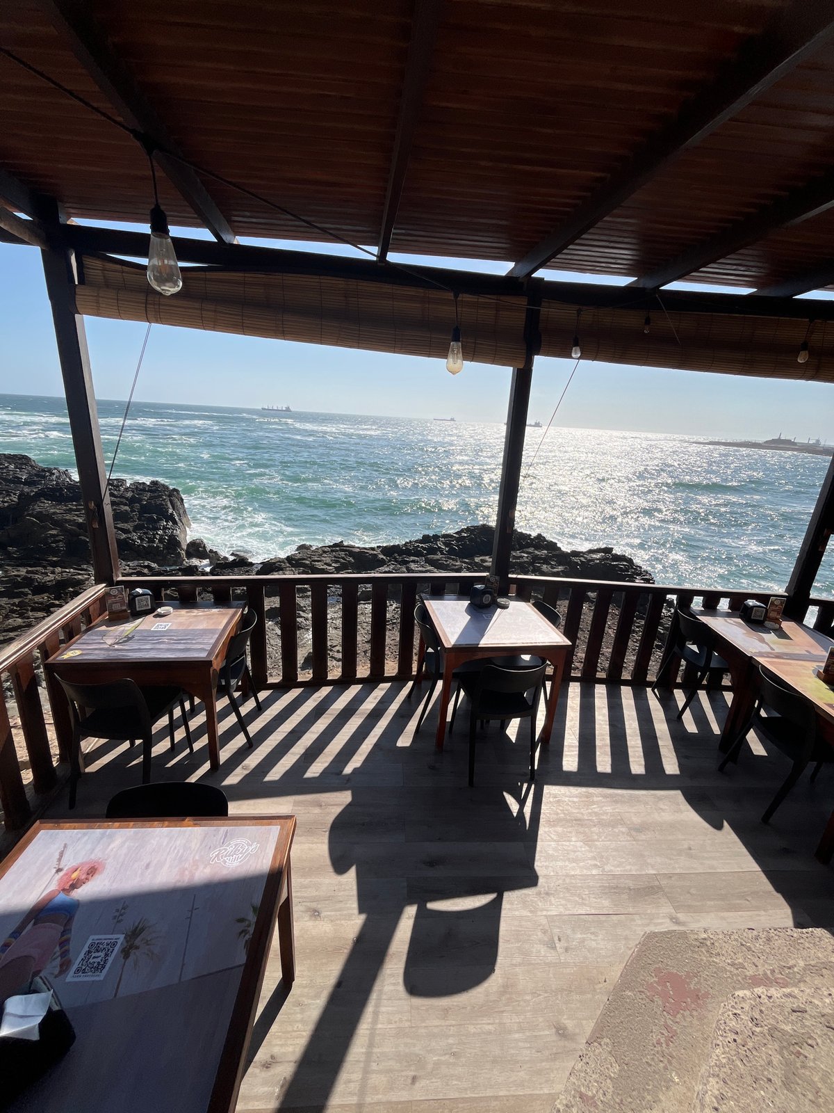 Oceanfront restaurant documented in Arica, Chile evening hours