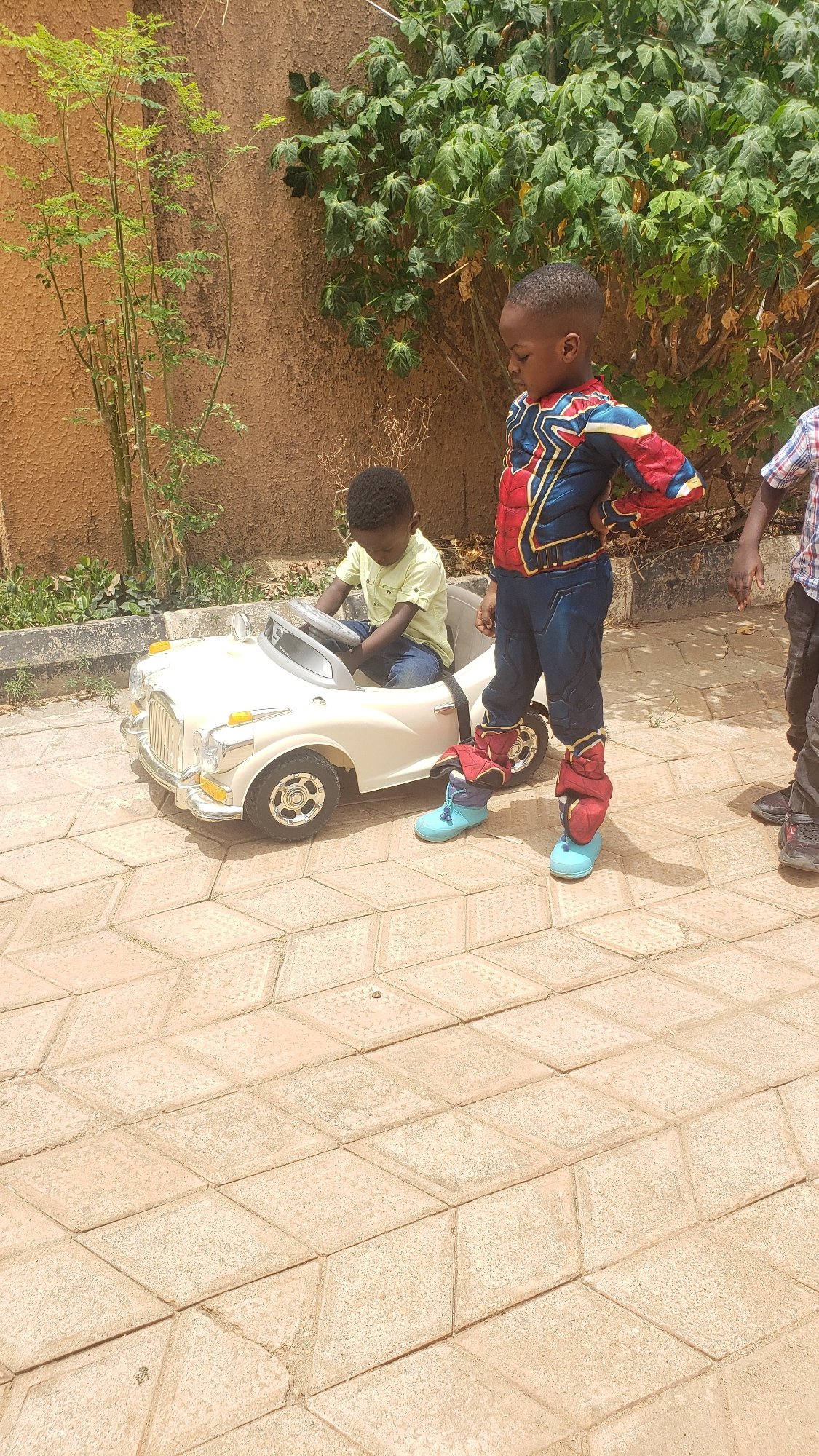 Boys play with toy car in Sabon Tasha