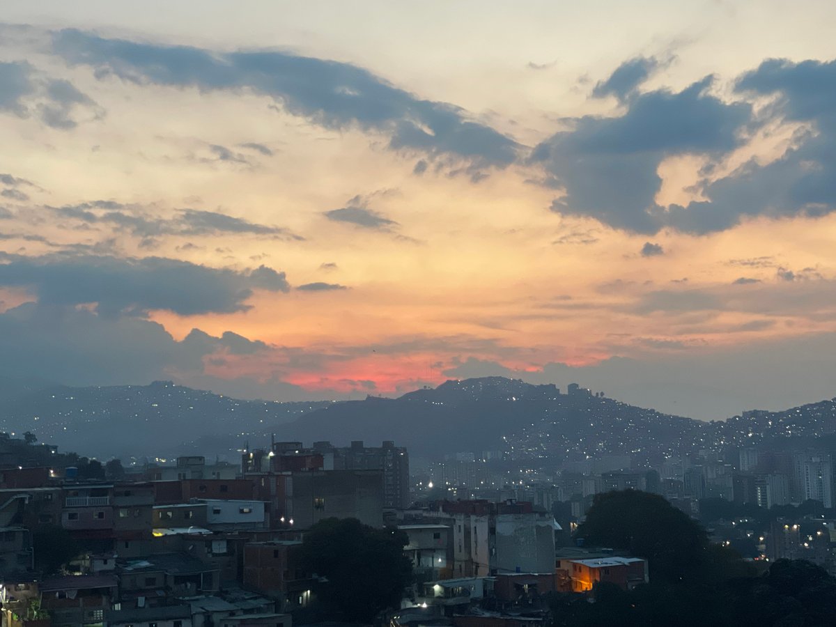 Dusk skyline captured over Caracas mountain cityscape