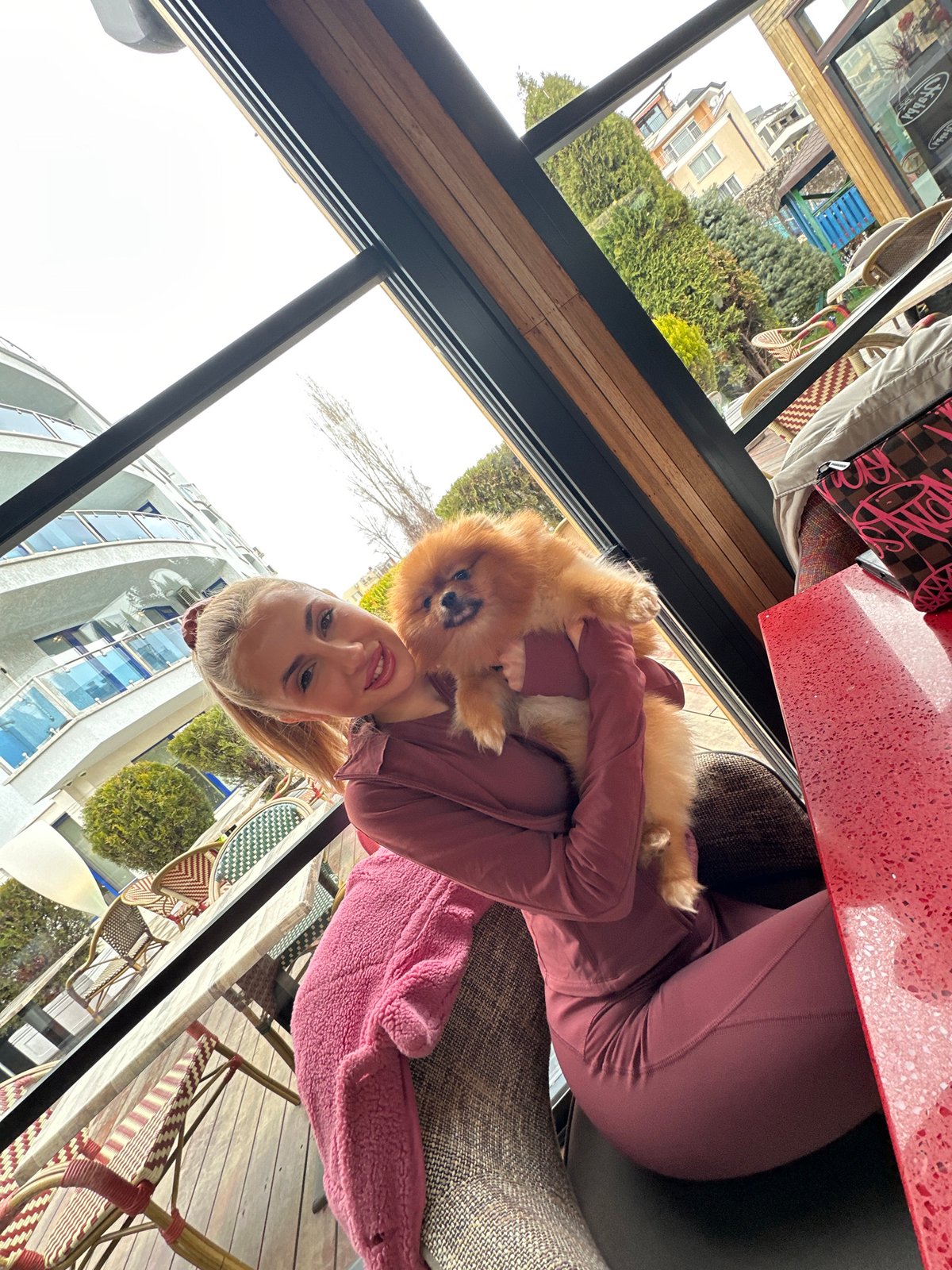 Restaurant gathering with friends and small dog in Sofia