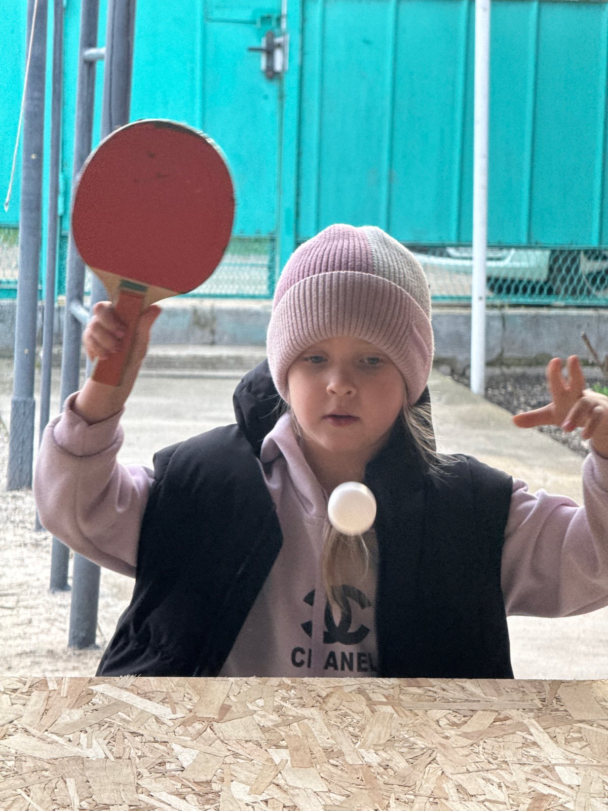 Girl plays outdoor ping pong in Besskorbnaya, Russia