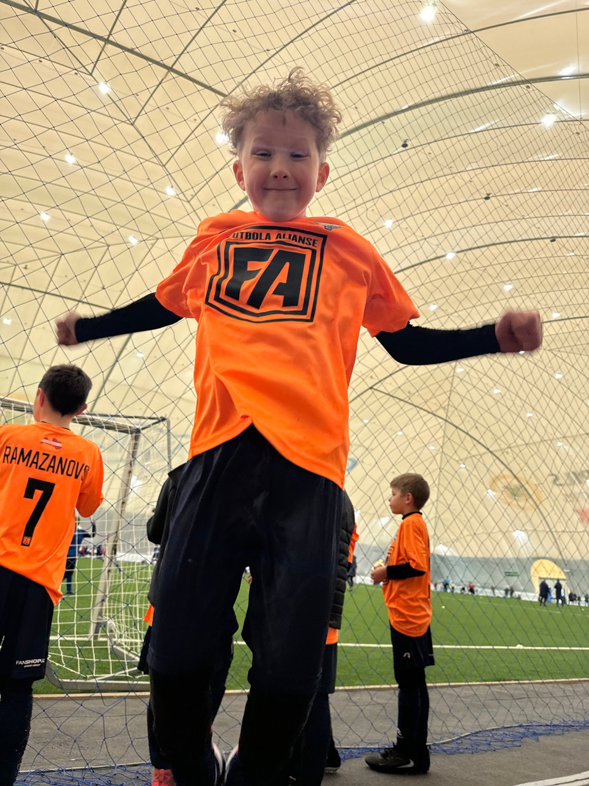 Youth soccer teams practice drills in Daugavpils indoor facility