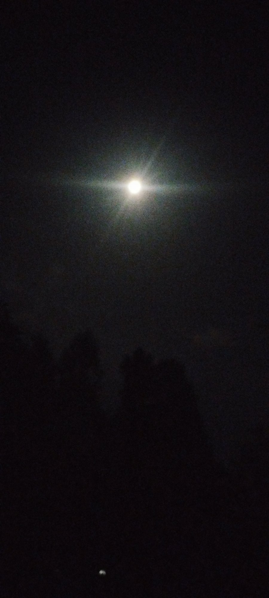 Bright full moon observed over Karateri, Uzbekistan evening sky