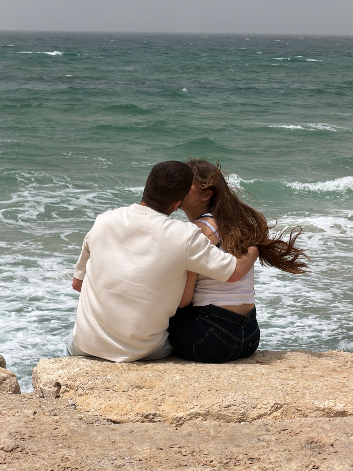 Romantic moment and kite flying captured along Tel Aviv coast