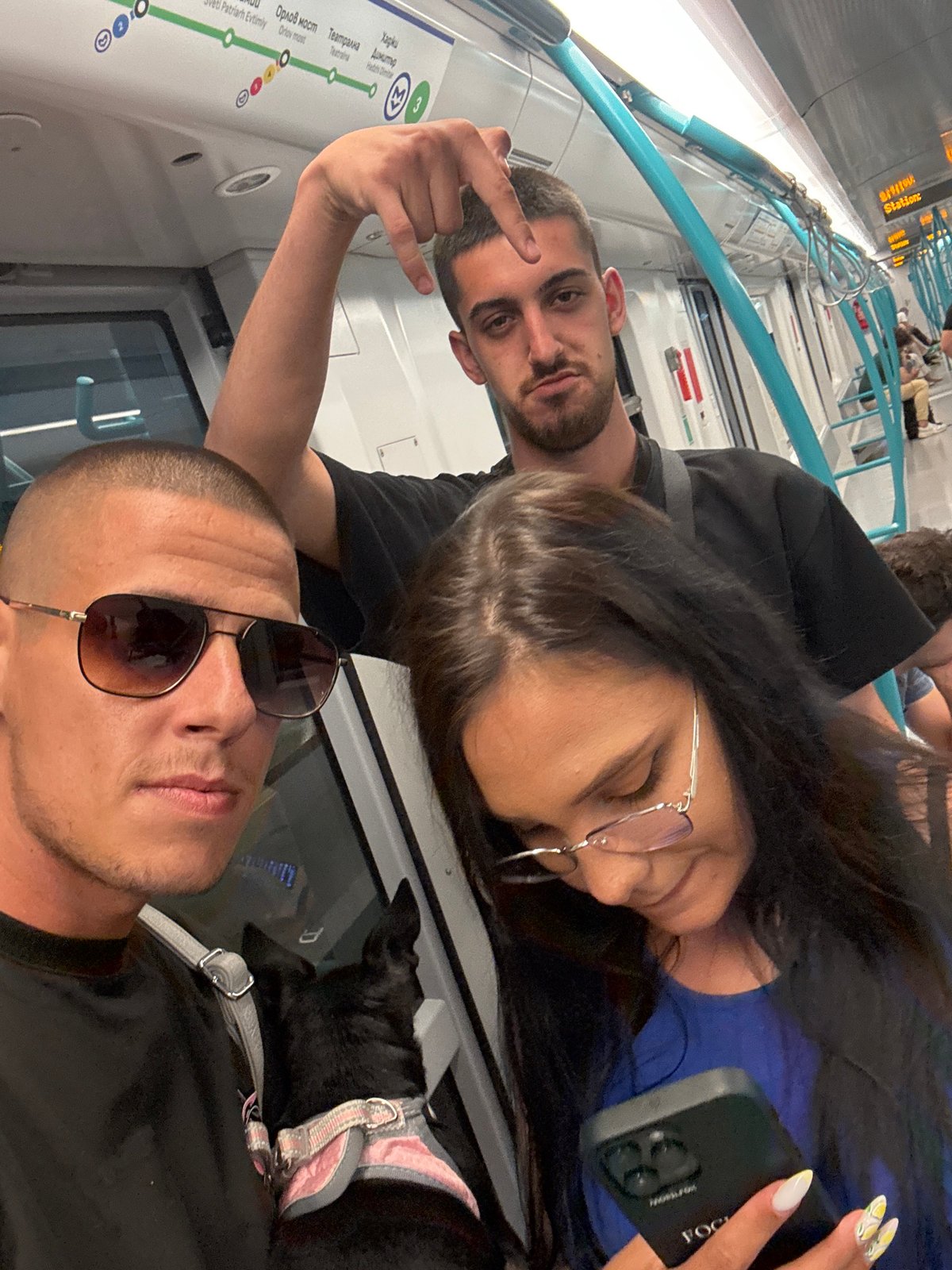 Passengers document casual moments aboard Sofia Metro train
