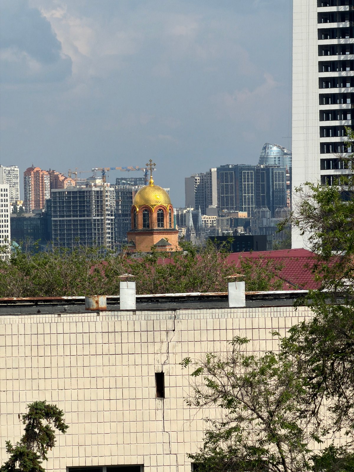 Musician documents instruments and cityscape during afternoon in Kyiv