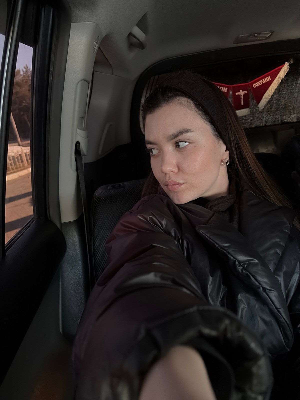Woman photographed in car during afternoon in Chaikovsky, Russia
