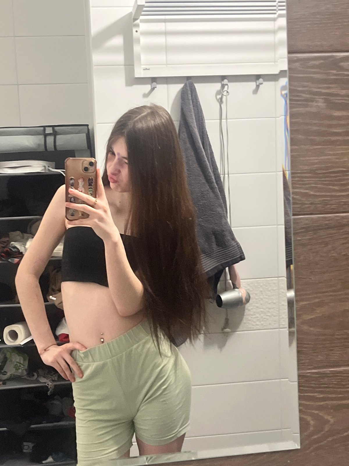 Woman takes bathroom mirror selfies in Saint Petersburg