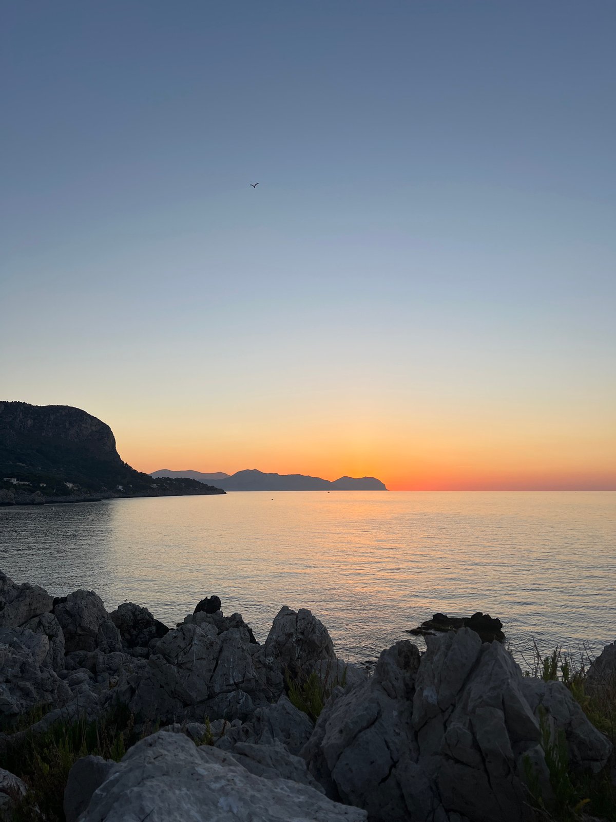 Sunset walk along the Sicilian coast near Bagheria's lighthouse