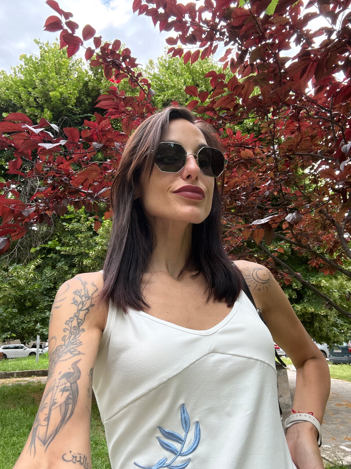 Woman takes selfies in park area in Pleven, Bulgaria