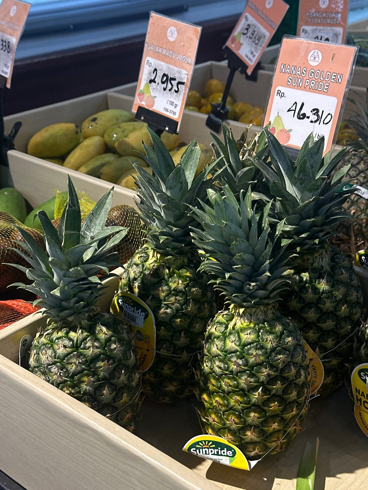 Browsing the fruit section of a North Kuta supermarket