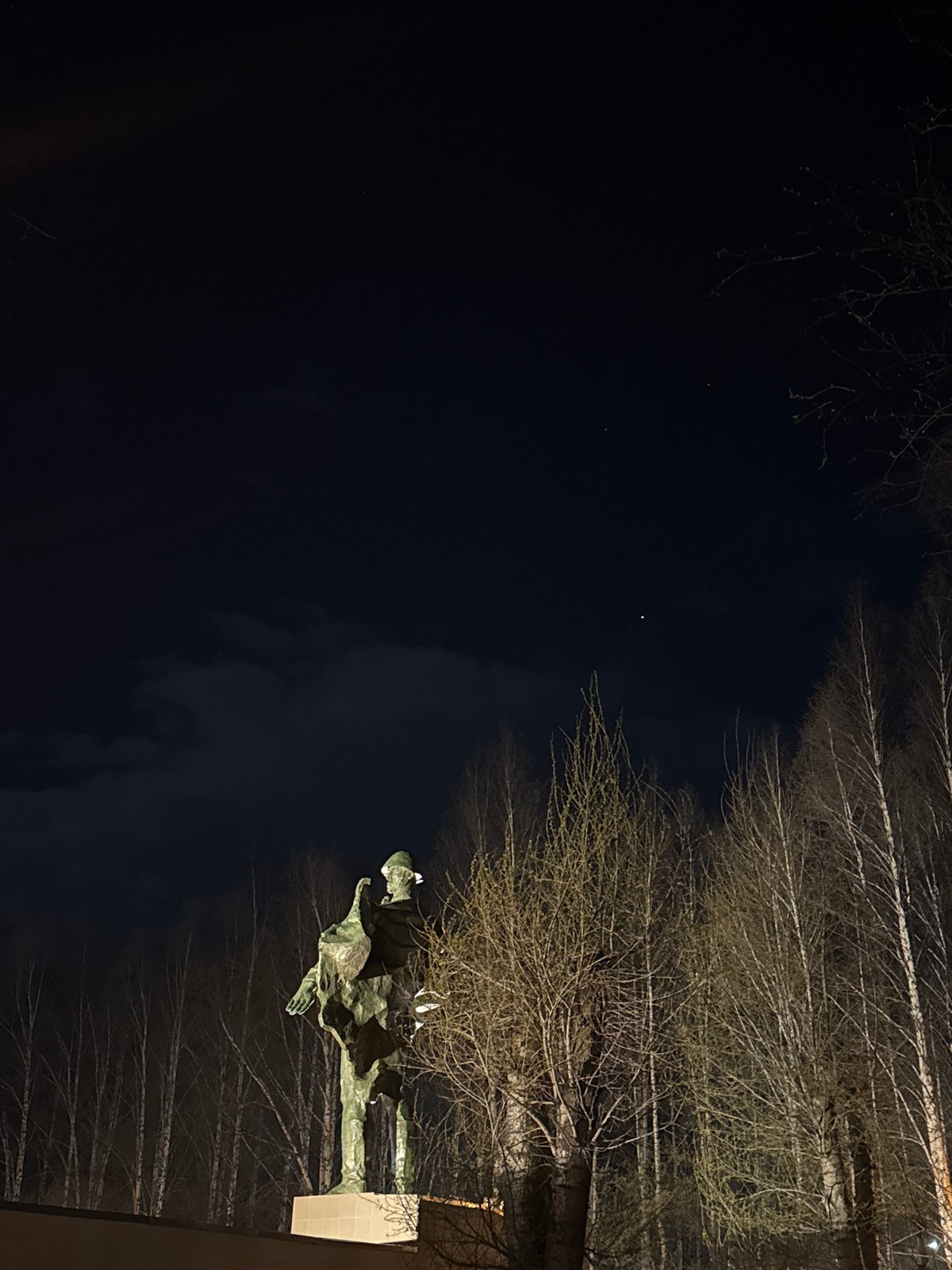 Nighttime scenes captured in Chernushka featuring monuments and Orthodox church
