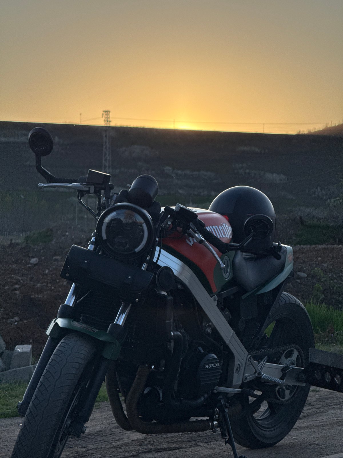 Motorcyclist takes sunset break in rural Montana, Bulgaria