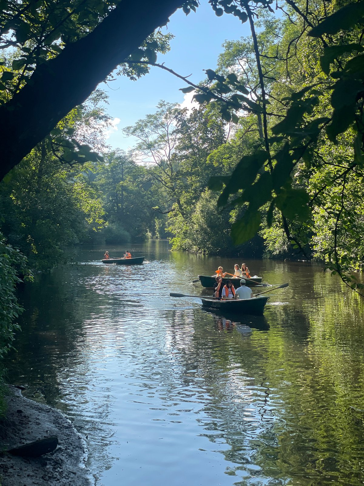 Rowboats, crowds, and street performers on a Saint Petersburg summer afternoon