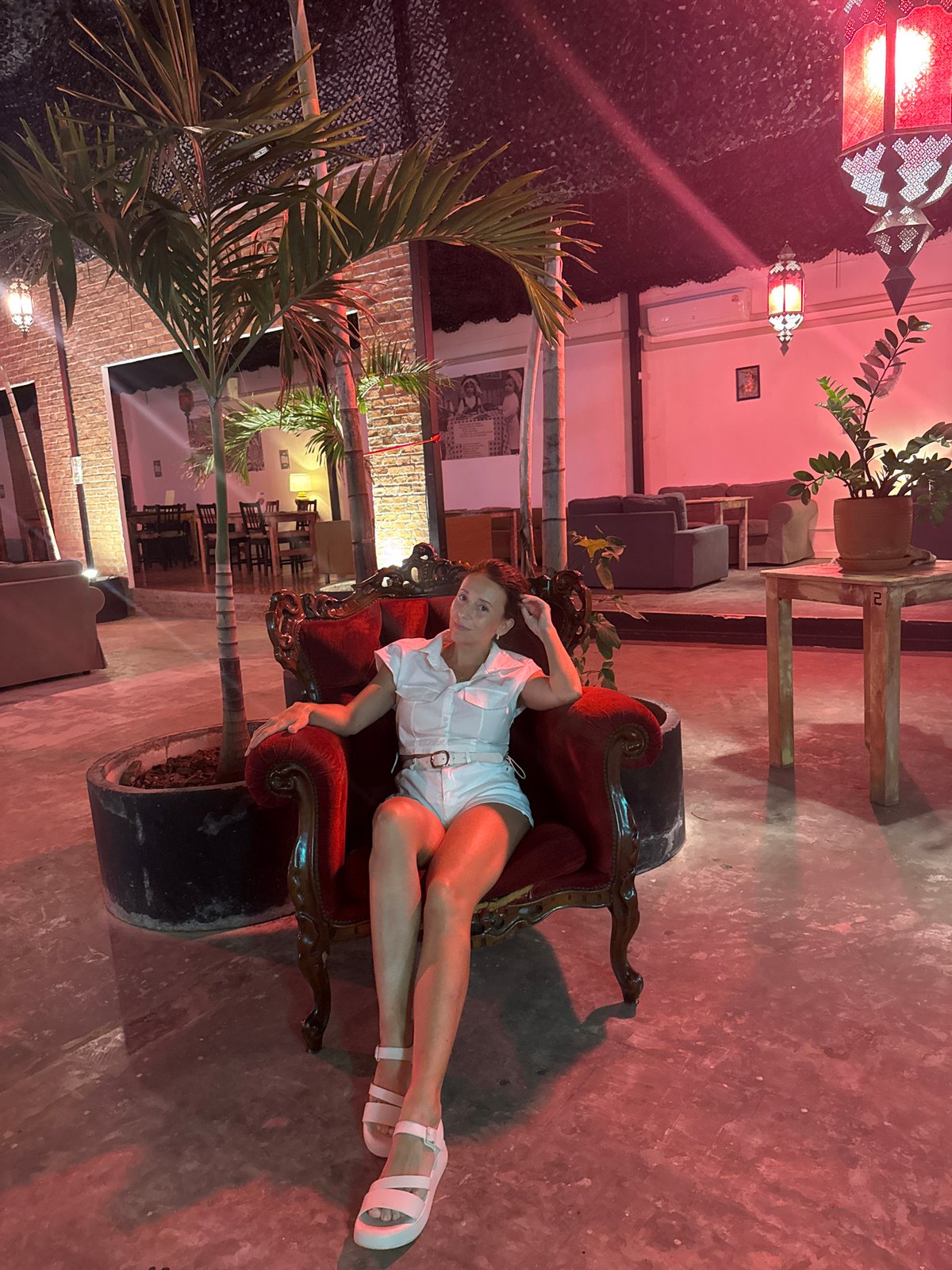 Red-lit lounge venue, inside and out