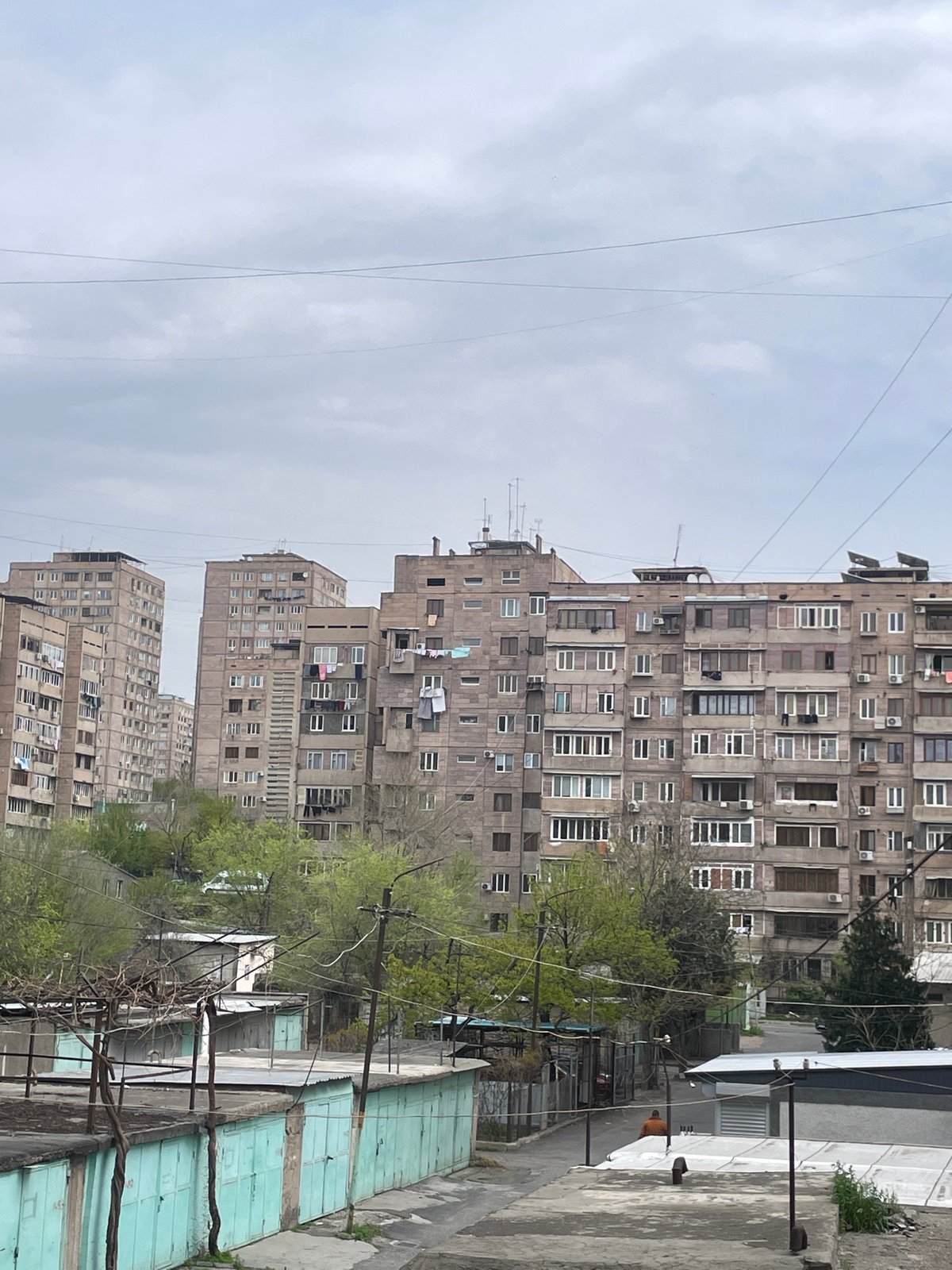 Morning documentation of Soviet-era buildings under overcast Yerevan skies