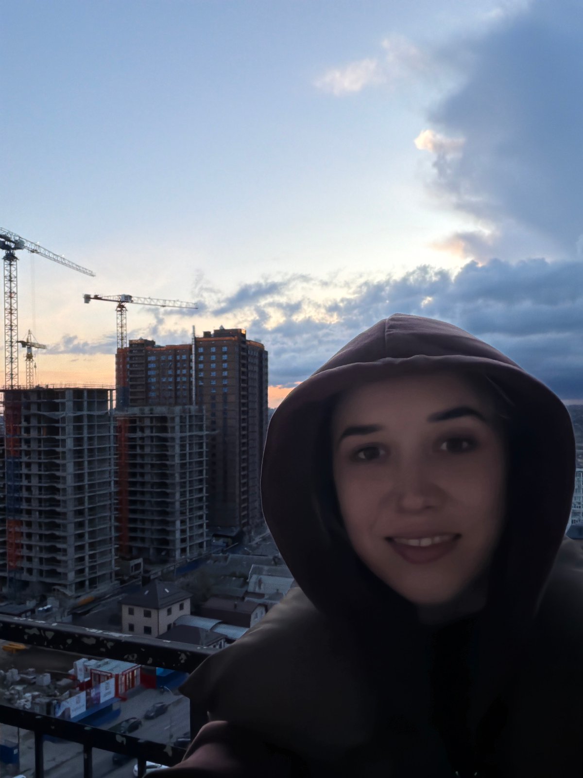 Woman captures selfie moment in Rostov-on-Don cityscape