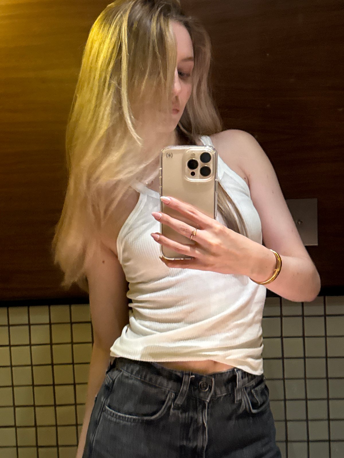 Woman takes mirror selfies in Mexico City bathroom