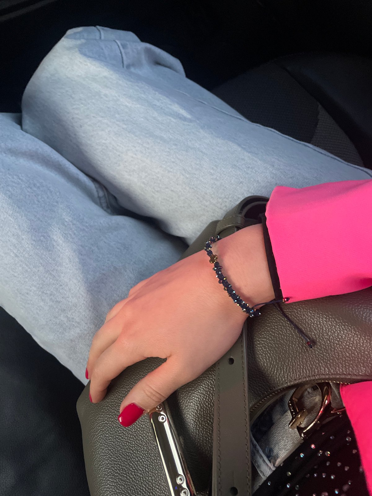 Woman in pink blazer observed at indoor venue in Varna