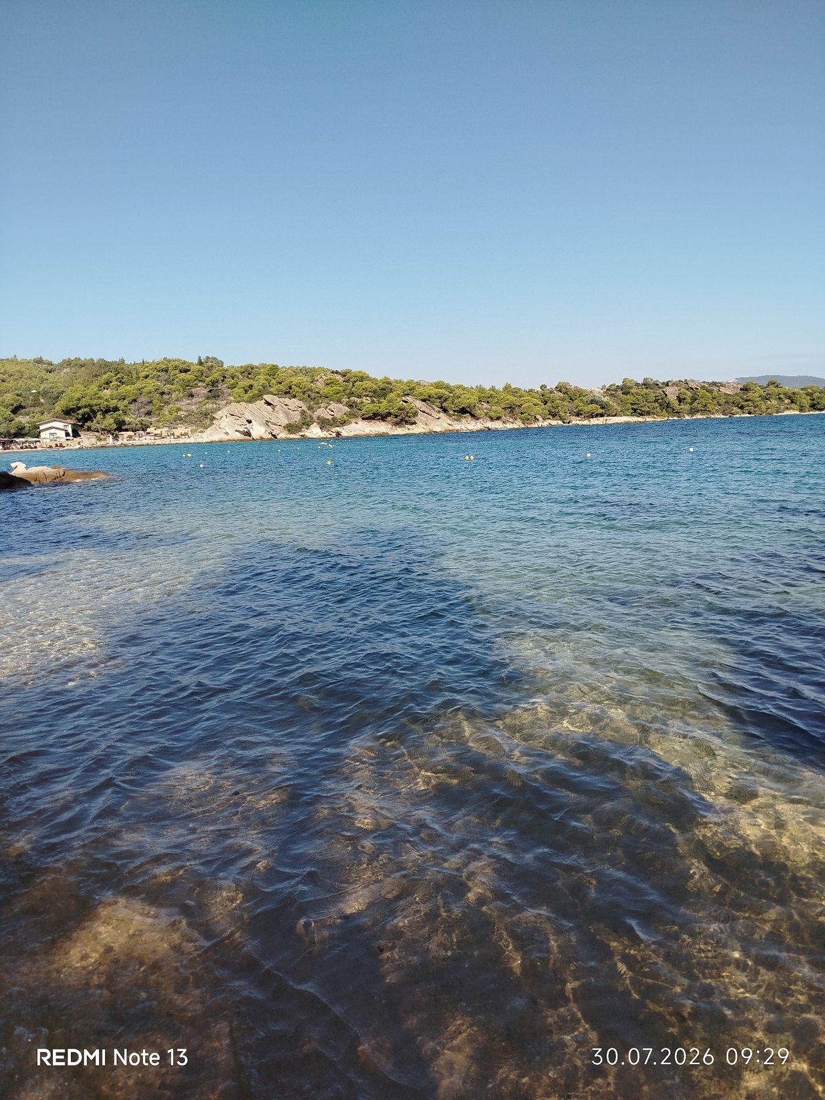 Calm morning on a clear-water beach in Sithonia, Greece