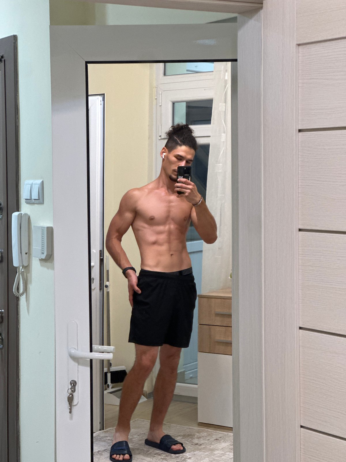 Mirror selfie session in a Varna apartment hallway