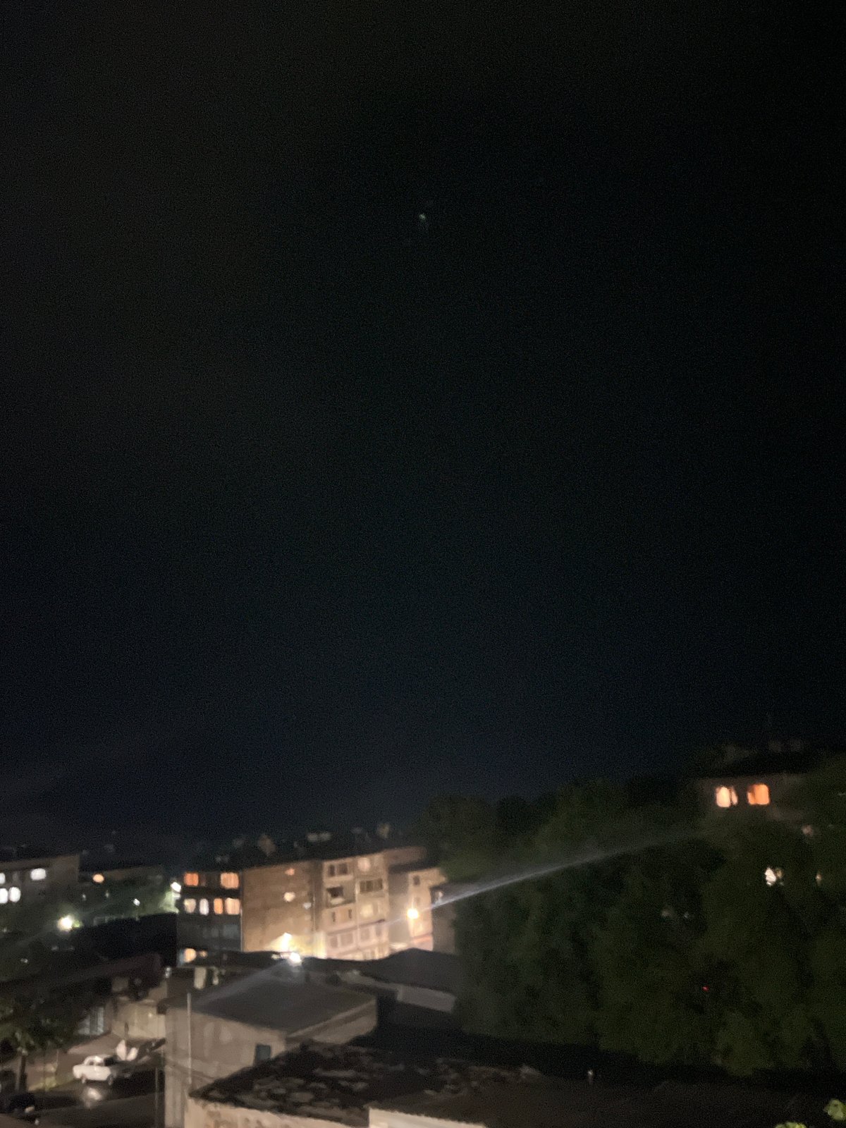 Lightning storm over Gladzor's residential neighborhoods at night