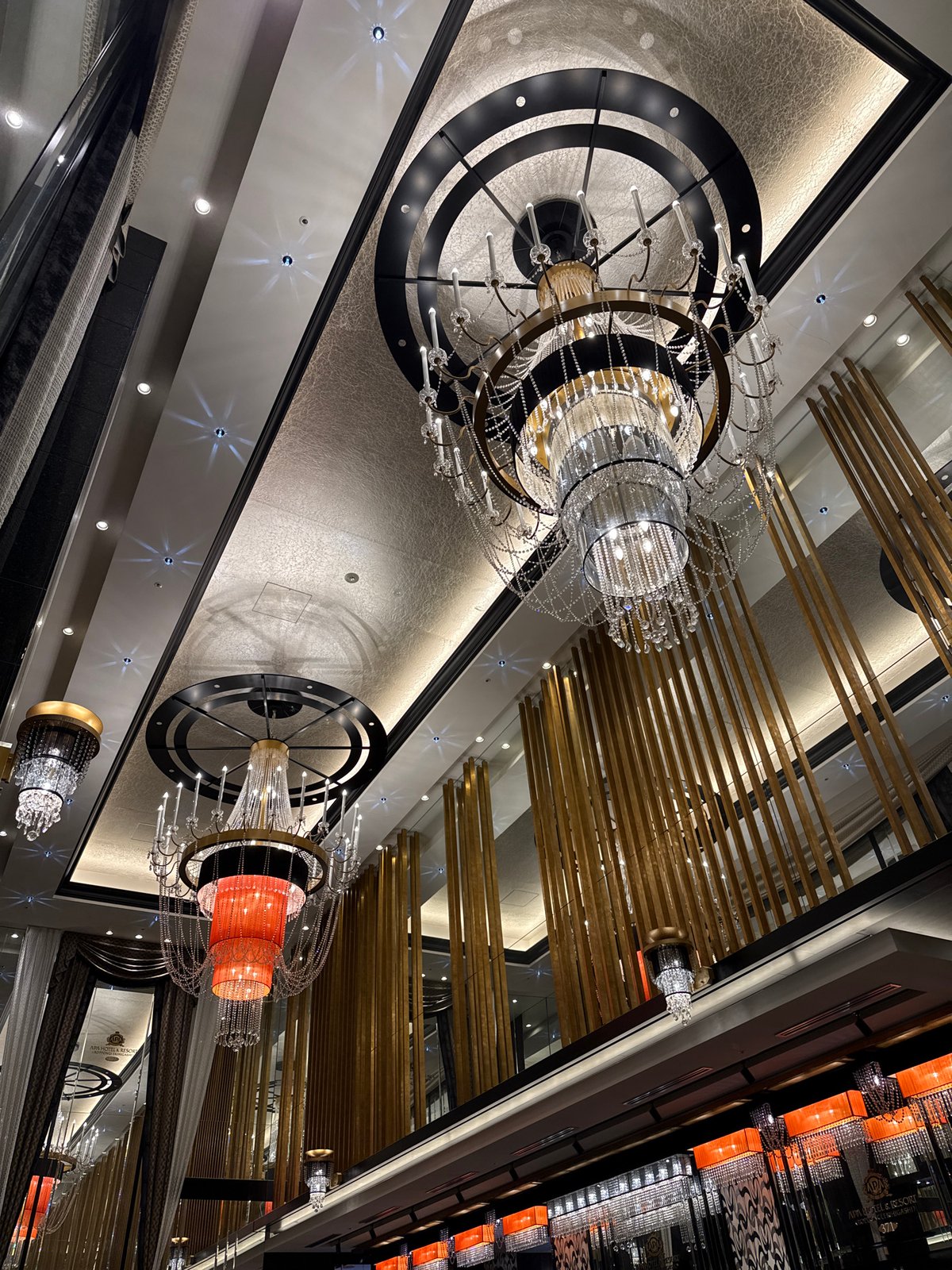 Ornate ceiling lighting captured in Minato building lobby
