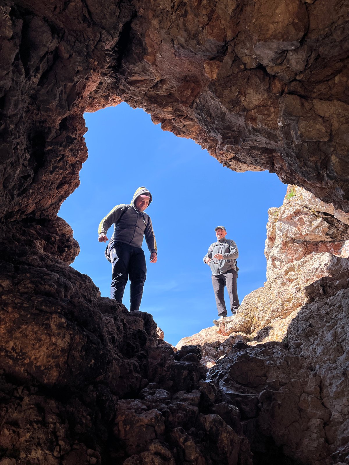 Hikers explore rocky cave formation in Krasnoyarsk, Russia