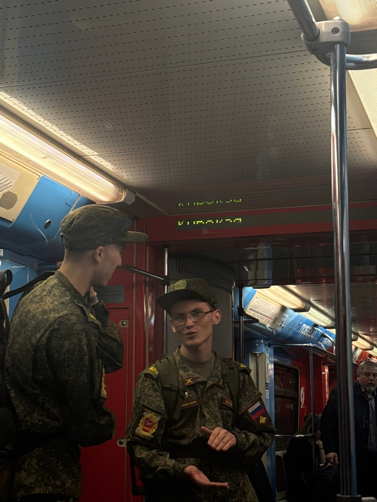 Russian soldiers ride Moscow Metro train through northwestern districts