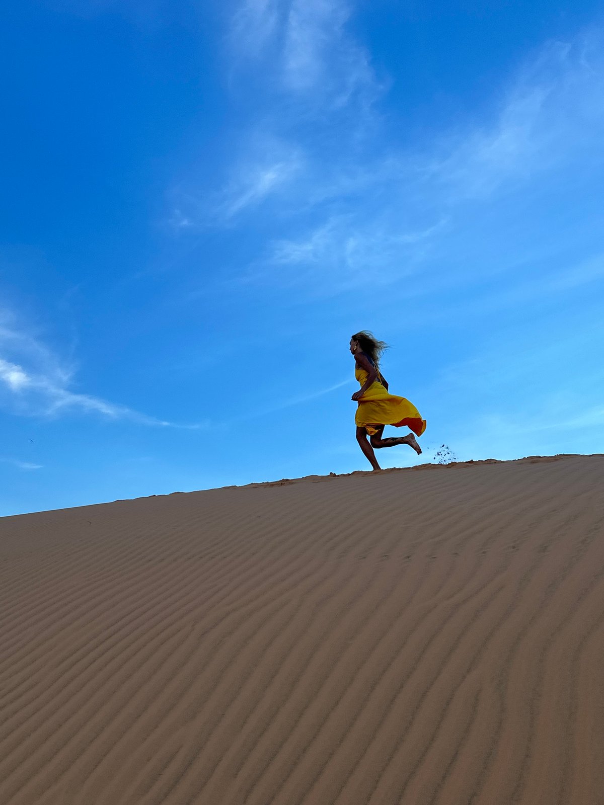 Posing and jumping through Mui Ne's sand dunes