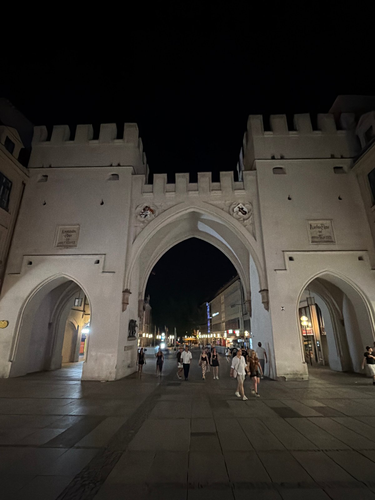 Munich's Karlstor and Michaelskirche illuminated at night