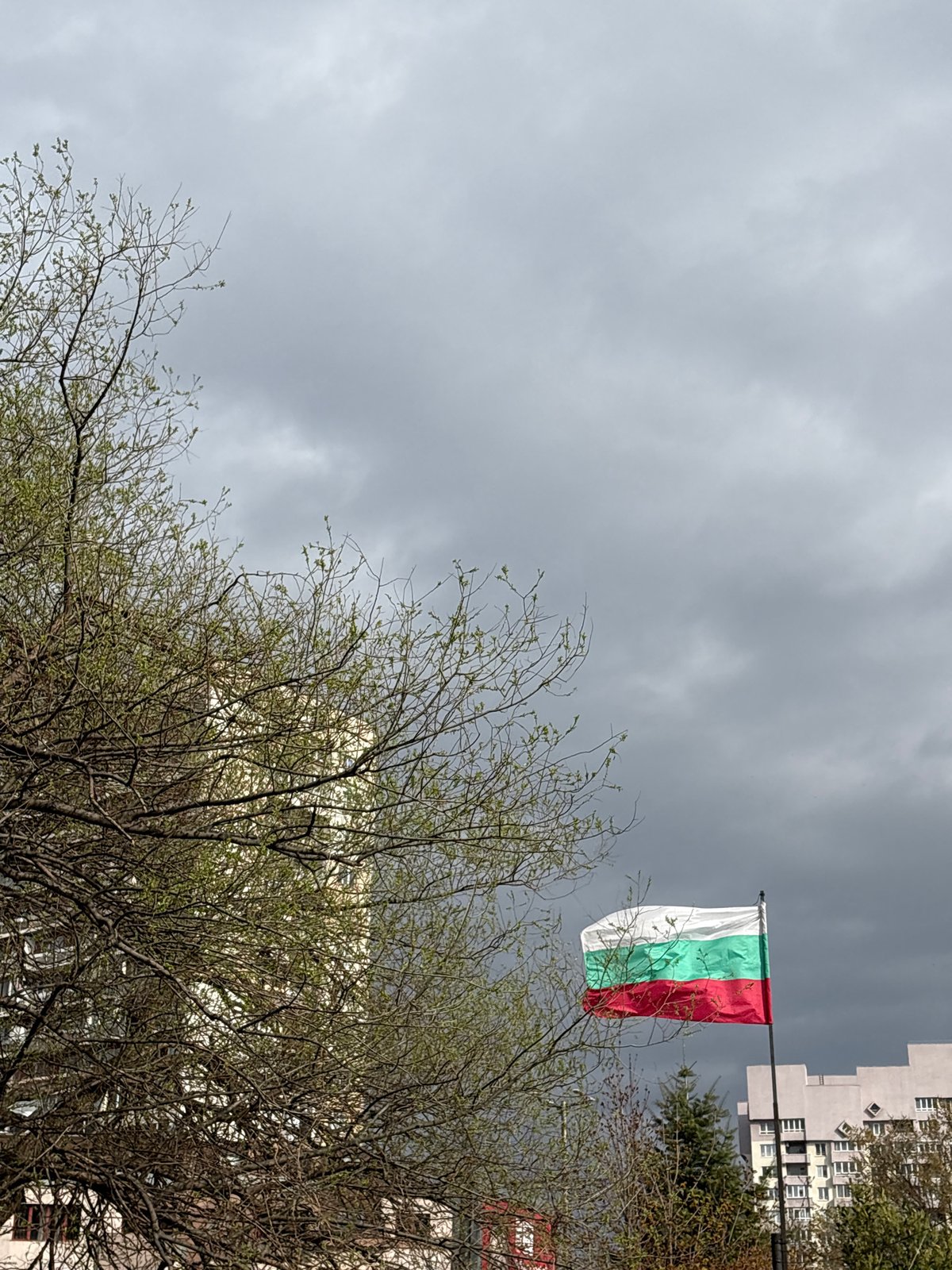 Bulgarian flag flies over Sofia on overcast spring morning