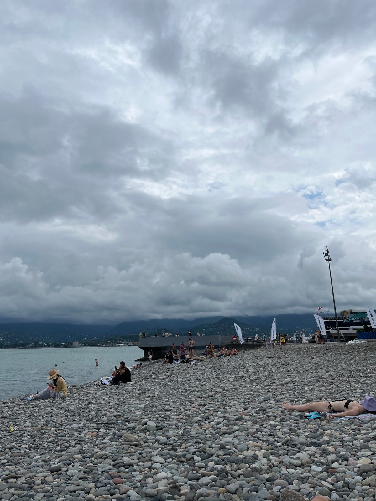 Overcast beach day on Batumi's Black Sea pebble shore