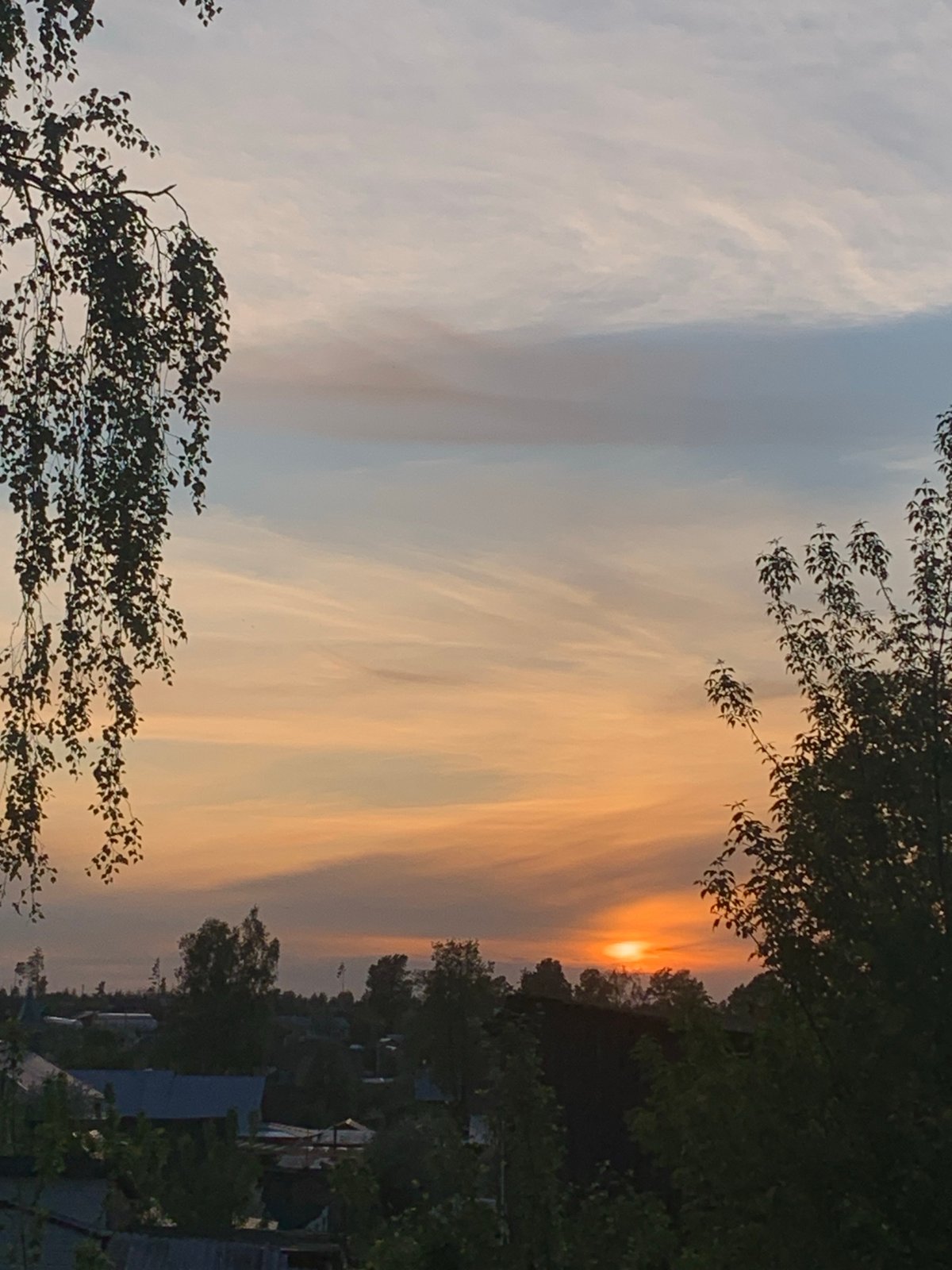 Sunset observed over Foki, Russia displays orange-blue sky