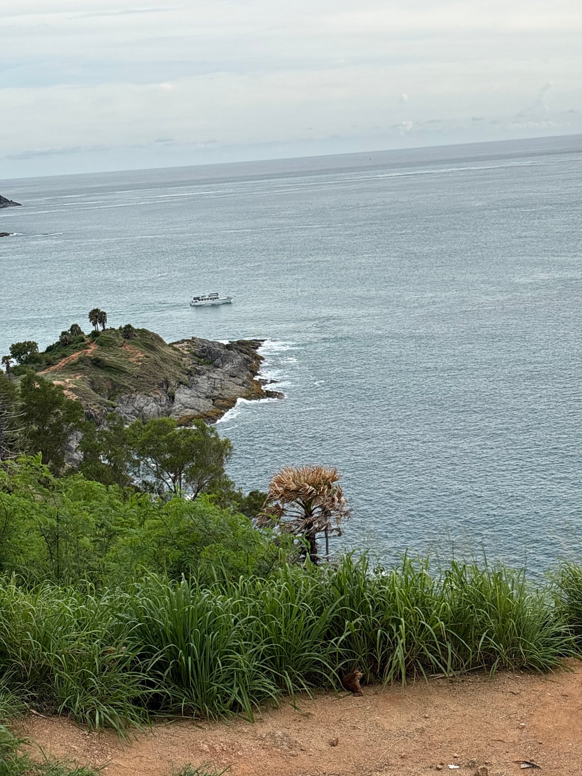 Morning at a Rawai coastal shrine with bay views